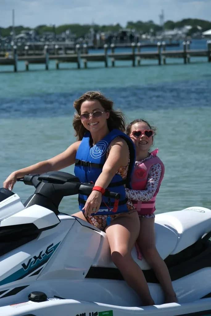 Riders on a jet ski approaching Crab Island, Okaloosa Island