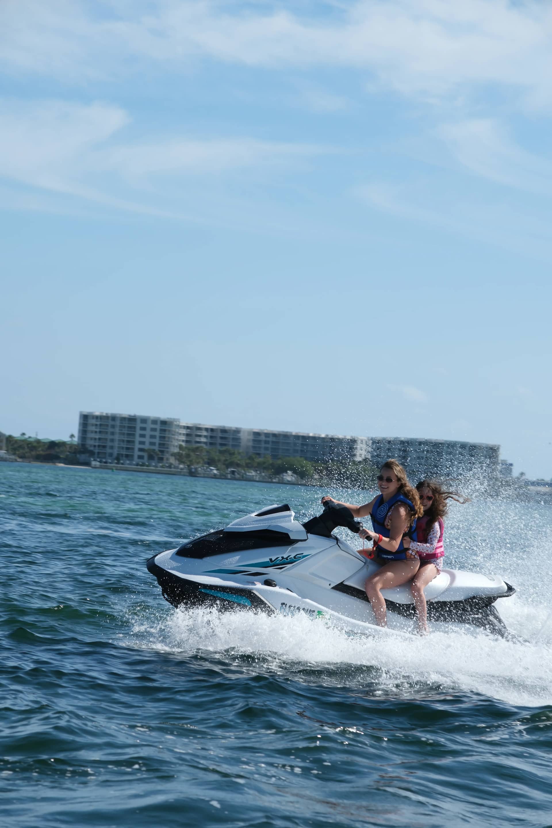 Jet ski cruising Choctawhatchee Bay with Okaloosa Island shoreline