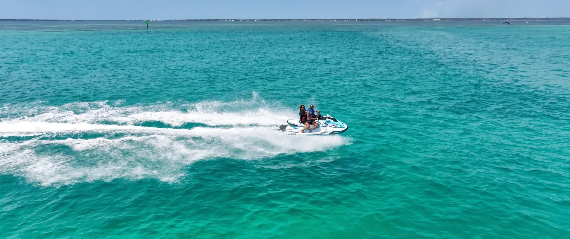 Riders enjoying Gulf Island Rentals jet skis on Choctawhatchee Bay near Crab Island